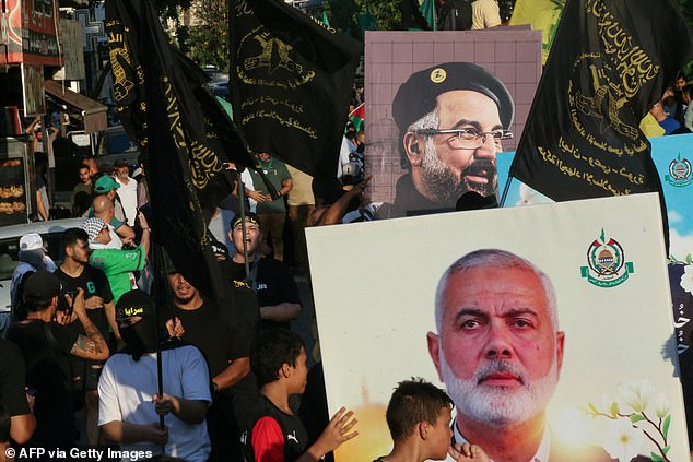 People take part in a march organized by Palestinian and Lebanese youth organizations in the southern Lebanese city of Saida, August 5, 2024, to protest the killing of Hamas leader Ismail Haniyeh