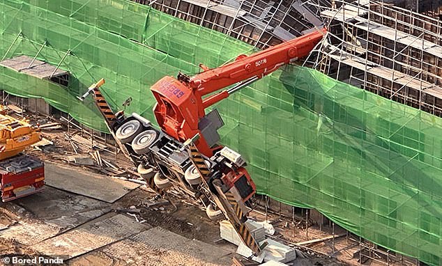 In another incident involving a crane, this vehicle overturned on a nearly completed building, crushing the roof