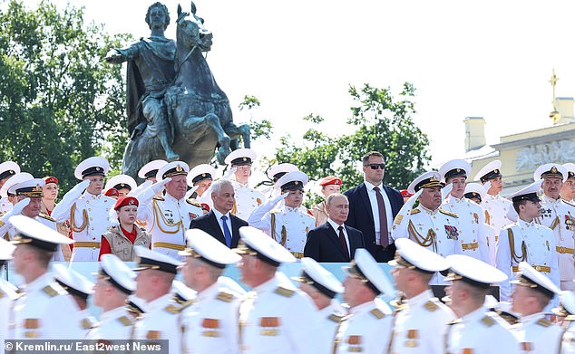 Putin and Belousov attend the Navy Day parade on July 28. Moscow claims that intelligence obtained indicated that Ukraine planned to kill both men.