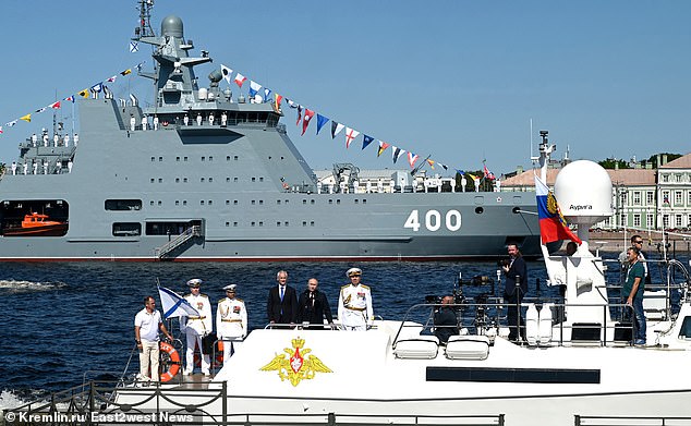 Putin and Belousov pose on a boat during the annual Navy Day parade on July 28, 2024