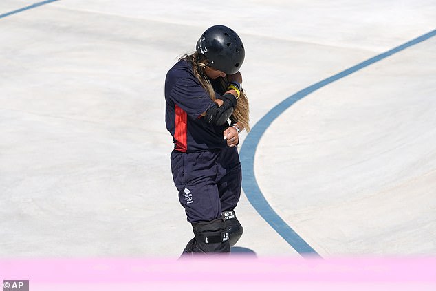 She grabbed her wrist and then her shoulder, the same shoulder she had dislocated before the Olympics.