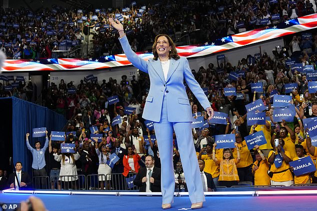 Vice President Kamala Harris waves during a campaign rally, July 30, 2024, in Atlanta