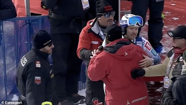 Henrik Kristoffersen, pictured wearing glasses, is held during the Alpine Skiing World Cup