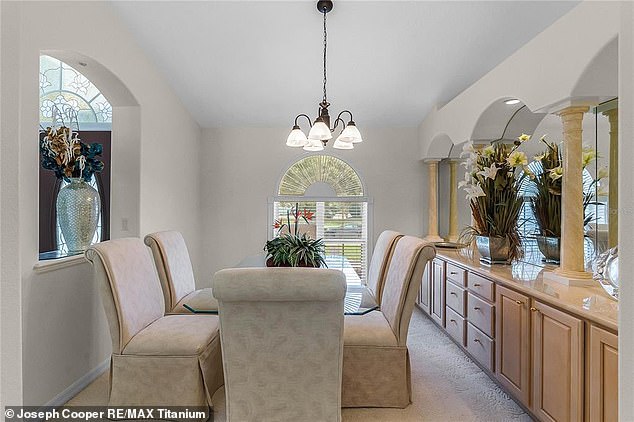 The pad has this formal dining room with a glass table and sophisticated beige chairs