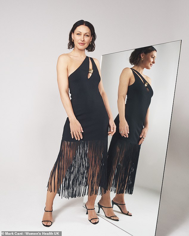 Emma shone in a third look in an asymmetrical black dress with fringe detailing around the hem and gold accents