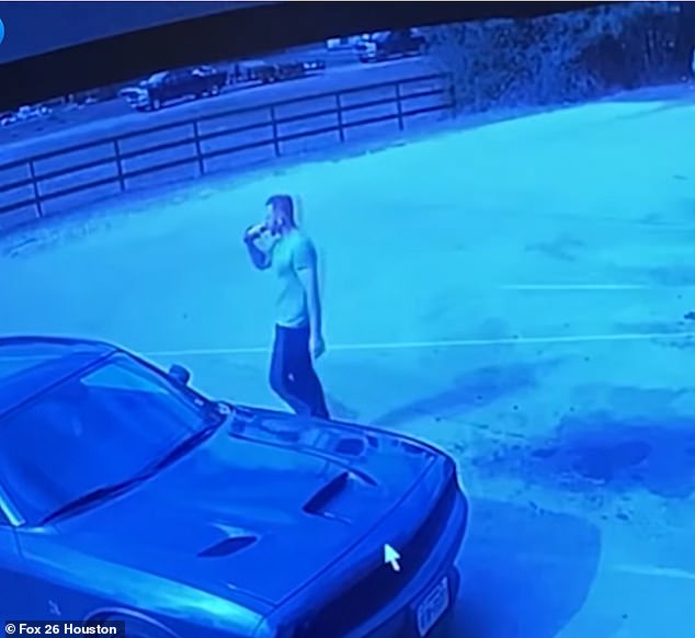 Dicus is then seen drinking a drink in the parking lot, while being captured on camera