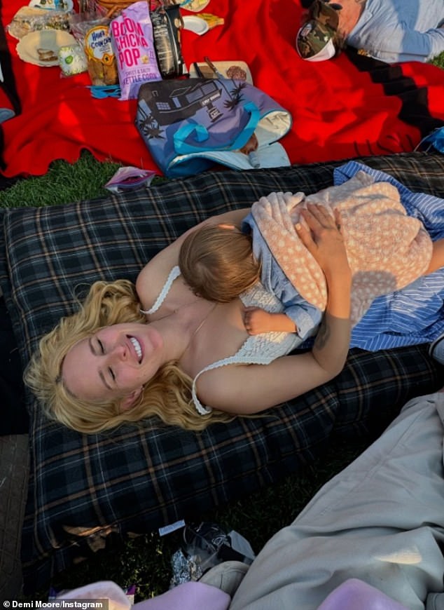 Demi's eldest daughter Rumer Willis snuggled up with her 15-month-old daughter while enjoying the free 40th Anniversary Gala concert featuring 19-time Grammy-winning cellist Yo-Yo Ma