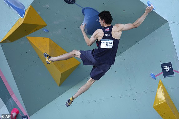 Hamish McArthur of Great Britain competes in the men's bouldering and sport climbing events during the 2024 Summer Olympics, Monday, Aug. 5, 2024, in Le Bourget, France. (AP Photo/Tsvangirayi Mukwazhi)