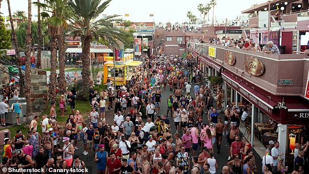 A busy street in Maspalomas, Playa del Ingles in 2023. Police saw footage showing an employee strangling a man outside a club in the area, they said.