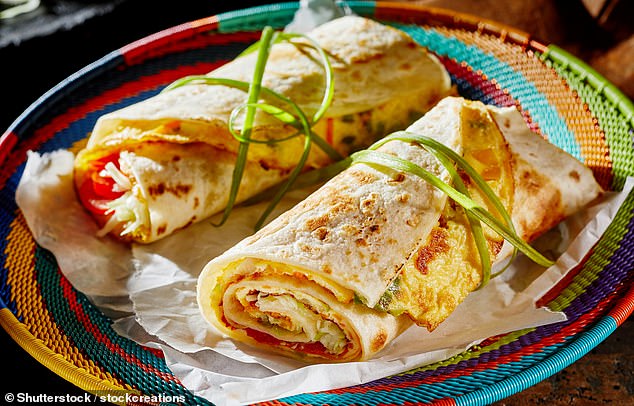 'My favourite food is the Rolex (pictured). It's an omelette wrapped in a chapatti and cooked fresh in front of you on an iron griddle at little roadside stalls,' says Alice (stock image)