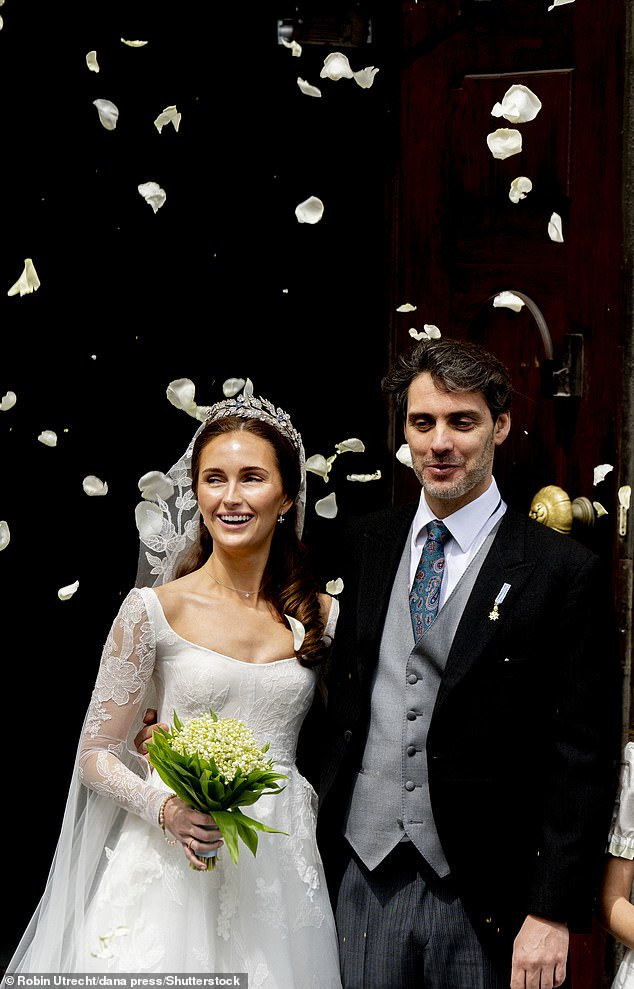 Sophie looked stunning in a classic white dress, featuring floral detailing on the princess skirt and sheer long sleeves