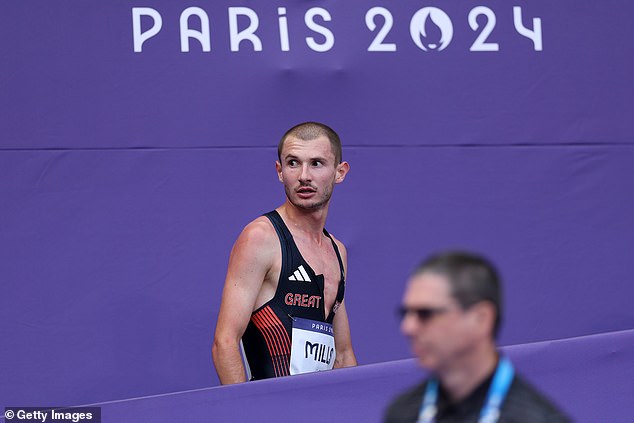 Team Great Britain's Mills reacts after competing in the Men's 5000m Round 1