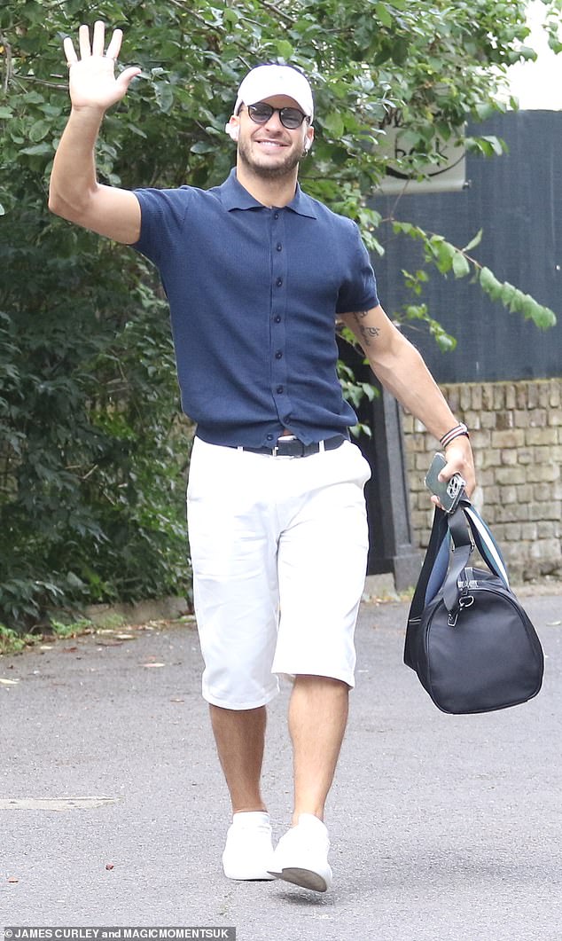 Vito Coppola was in high spirits, smiling and waving for the cameras as he entered with his dance bag in one hand, dressed in a tight blue shirt and long white shorts