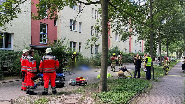 The fourth victim, 72, was killed and her house in an apartment building was set on fire in the Plaenterwald district bordering Neukoelln around noon on July 24 (scene pictured above)