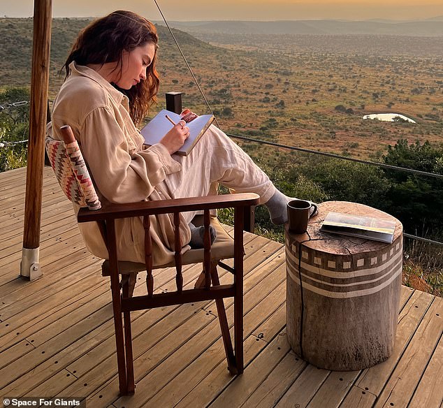 The English actress put her feet up and wrote in her diary in the photos taken just before sunset