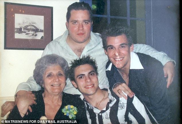 John (black and white shirt) pictured as a young man at his grandmother's birthday, had a fiancée, a great job and was physically fit before the neurological condition took him over