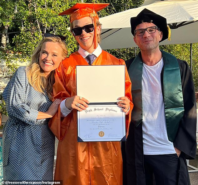 Reese and Ryan are also the friendly co-parents of a 20-year-old son named Deacon, who they're pictured with celebrating his high school graduation