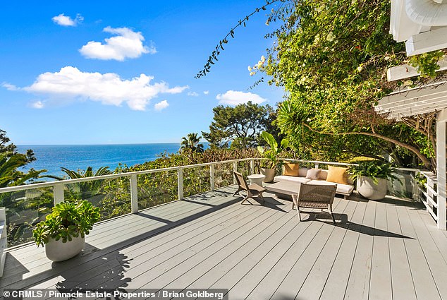 Built in 1960, the 3,700-square-foot home is steps from the beach and features a pool, spa, guest house and patio with stunning ocean views.