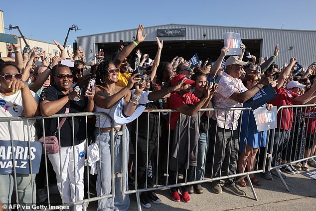 Supporters cheer on Kamala Harris and Tim Walz