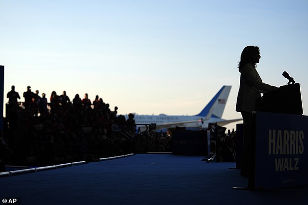 Kamala Harris speaks with Air Force Two behind her