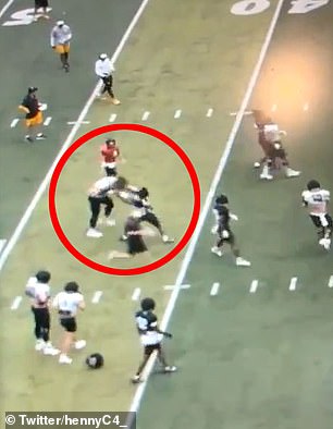 The defender in black can be seen at one point ripping off his rival's helmet