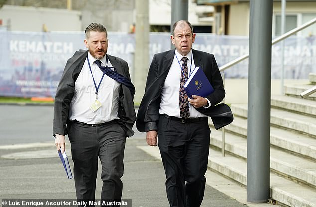 Detectives from the Homicide Squad leave the court on Thursday