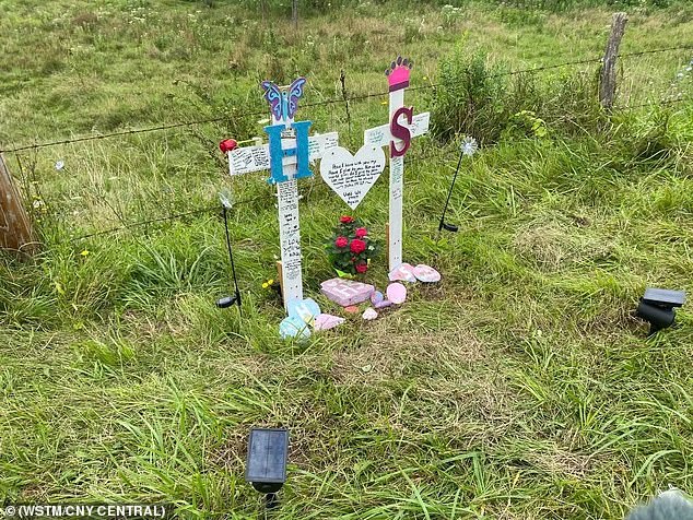 In honor of the sisters, a memorial with large white crosses has been erected at the site of the accident