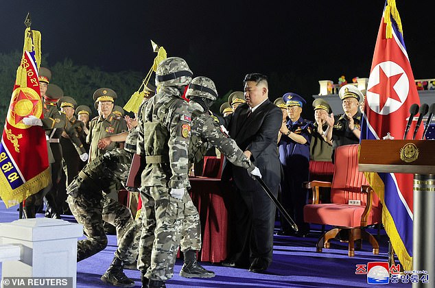 Kim Jong Un during the ceremony marking the delivery of new tactical ballistic missiles at an undisclosed location on August 4