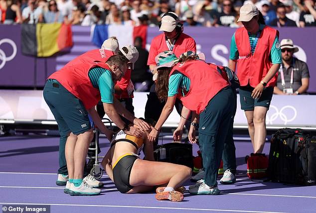 She was helped into a chair before being wheeled away, with the race starting moments later