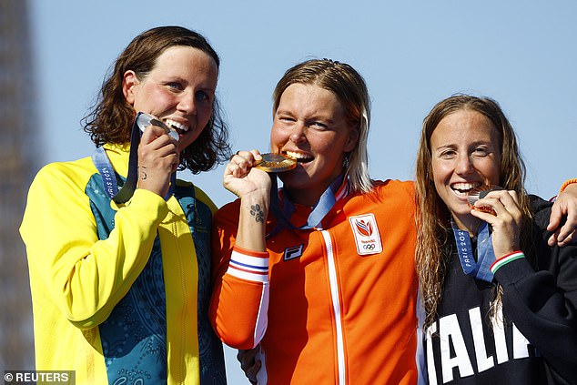 Johnson was eventually overtaken in a thrilling three-woman open water race by top Dutchwoman Sharon van Rouwendaal, who reclaimed the crown she won in Rio eight years ago