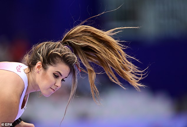 Maria is pictured throwing back her long luscious hair. She will compete for the second and final time at the Stade de France stadium during the games in Paris for the women's javelin final on Saturday