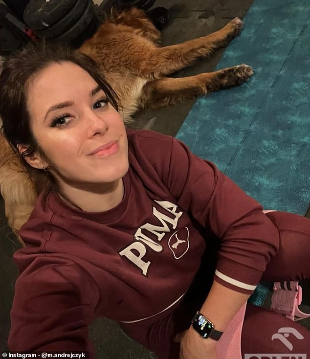 Maria is pictured cuddling her dog. Her appearance in Paris will be her first Olympic Games since her impressive display of generosity following the 2020 Tokyo Games