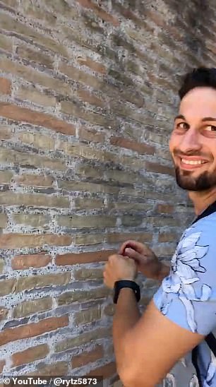 A bystander filmed Mr. Dimitrov as he carved the names into the stone walls