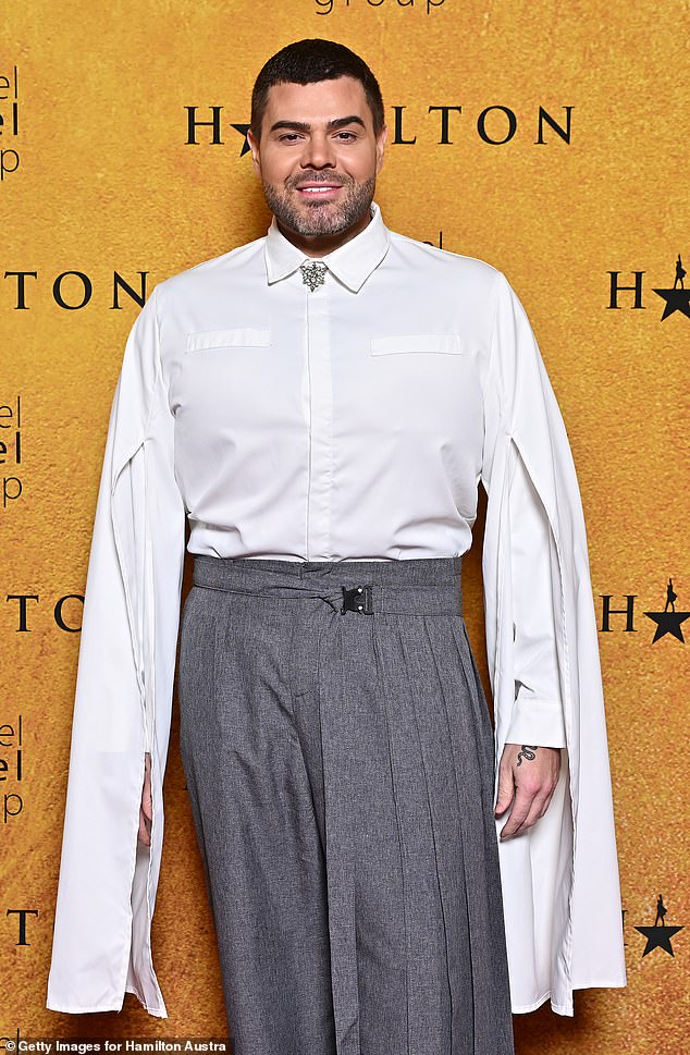 Justin Hill made a bold fashion statement in a white shirt with dramatic, billowing sleeves