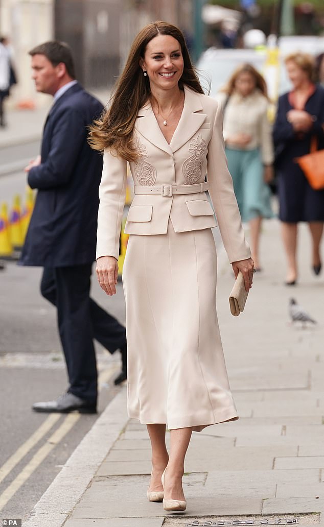 Kate Middleton, the Duchess of Cambridge, is pictured wearing the same skirt suit in April 2022