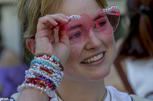 Swift fan Jenny, from Vienna, exchanges bracelets in the city center