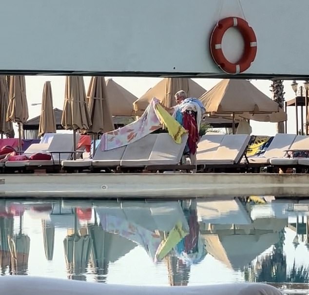 TikTok user The Railway Queen shared a video showing a manager at her hotel in Turkey piling towels on his shoulder in an attempt to free up space by the pool