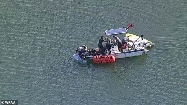 First responders pulled a body from Marine Creek Lake on Thursday and placed it in a body bag. It is unclear if the body was Đukić