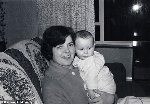 Liz is photographed as a baby in the arms of her adoptive mother, Janice Harrison, who praised Liz as a 