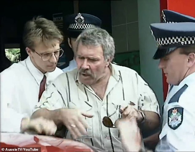 Karlson (pictured center) has always maintained that his arrest in 1991 was the result of a mistake