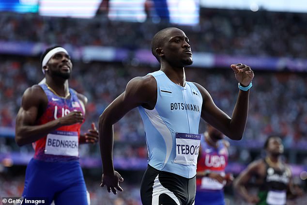 Team Botswana's Letsile Tebogo celebrates winning the gold medal in the 200m final