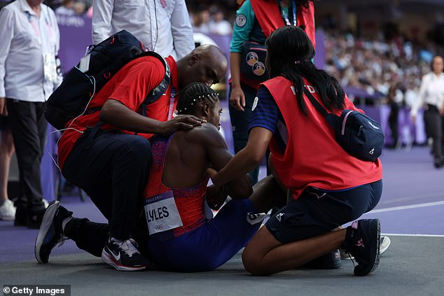 Doctors rush to help Lyles after he falls to the ground and struggles to breathe