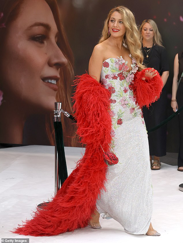 Sparkling silver heels were visible beneath her floor-length hemline as she walked the white carpet