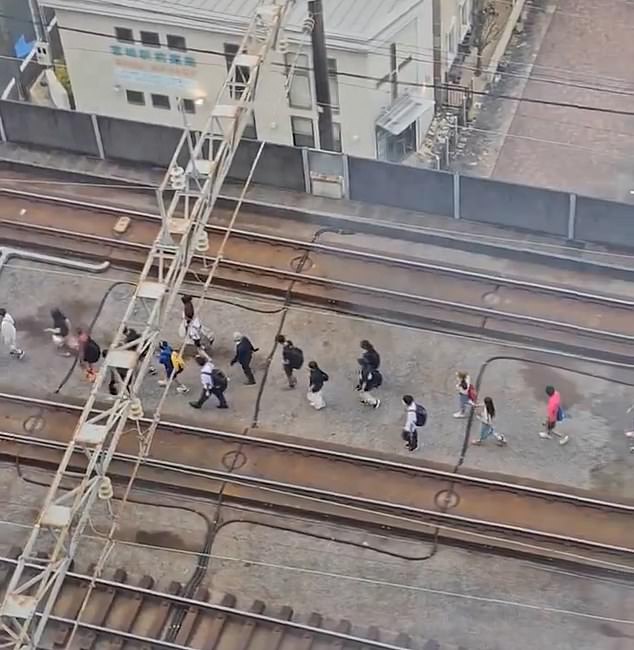 People evacuate trains in Japan due to today's earthquakes and widespread cancellations