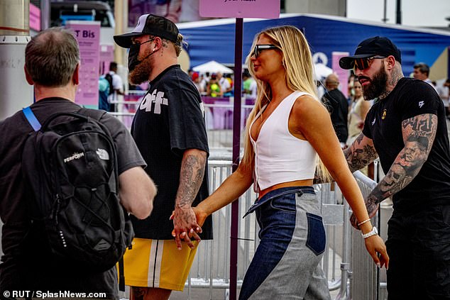 The couple held hands as they arrived with guards on Thursday afternoon