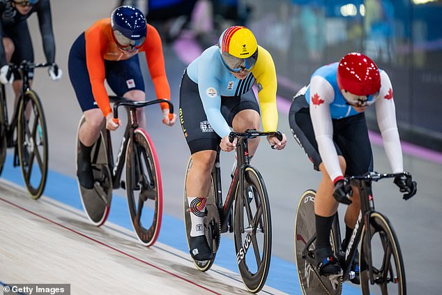 The women's keirin heat was going smoothly until Van der Peet's (orange) bike slipped from under her