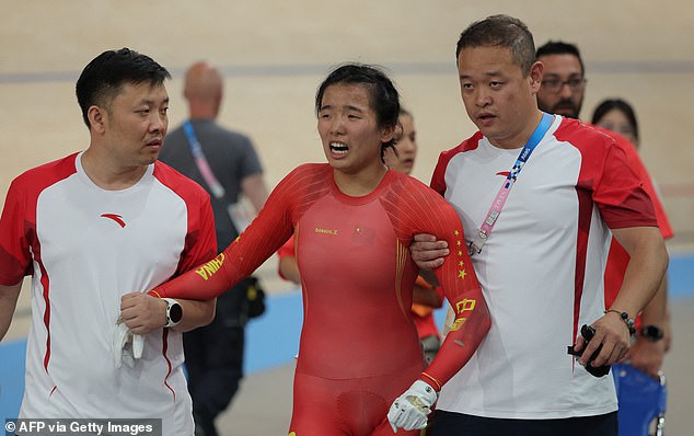 Chinese Liying appeared visibly upset as she was helped off the track by support staff