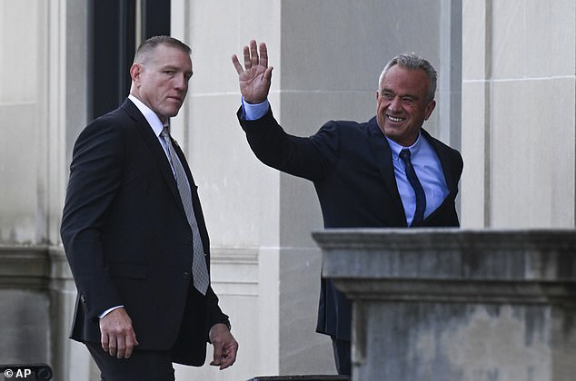 Robert F. Kennedy Jr. waves to supporters as he enters court Wednesday. As he left, he told reporters he had a 