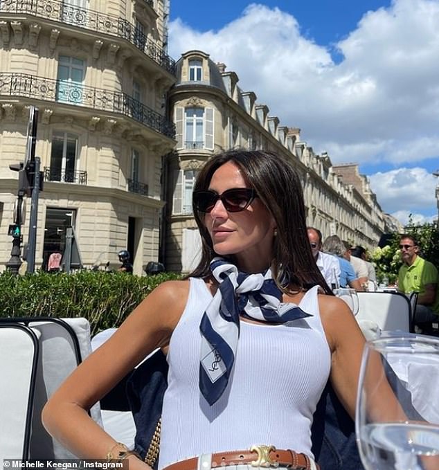 Michelle shared photos of herself enjoying a drink outside in the sunny weather earlier today