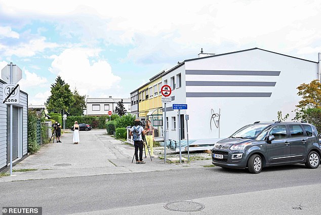 The 19-year-old man - who lived with another man in his parents' house (white house in the photo on the right) - was arrested on Wednesday after police searched the house, Kronen Zeitung reported